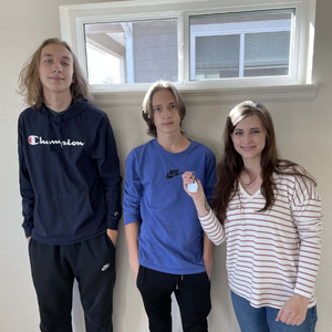 Family photo with mother and two teenagers